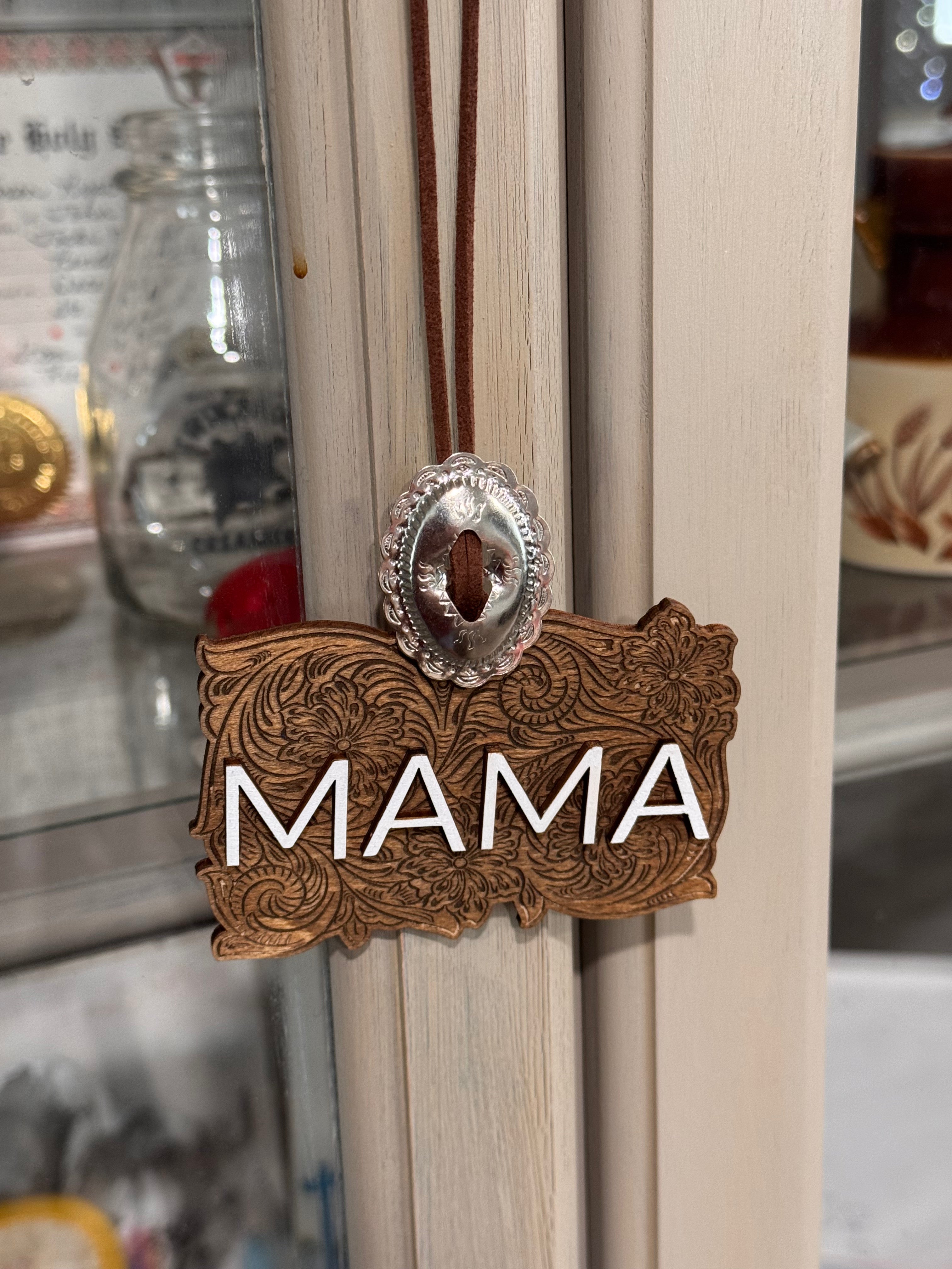 White lettering Mama car charm